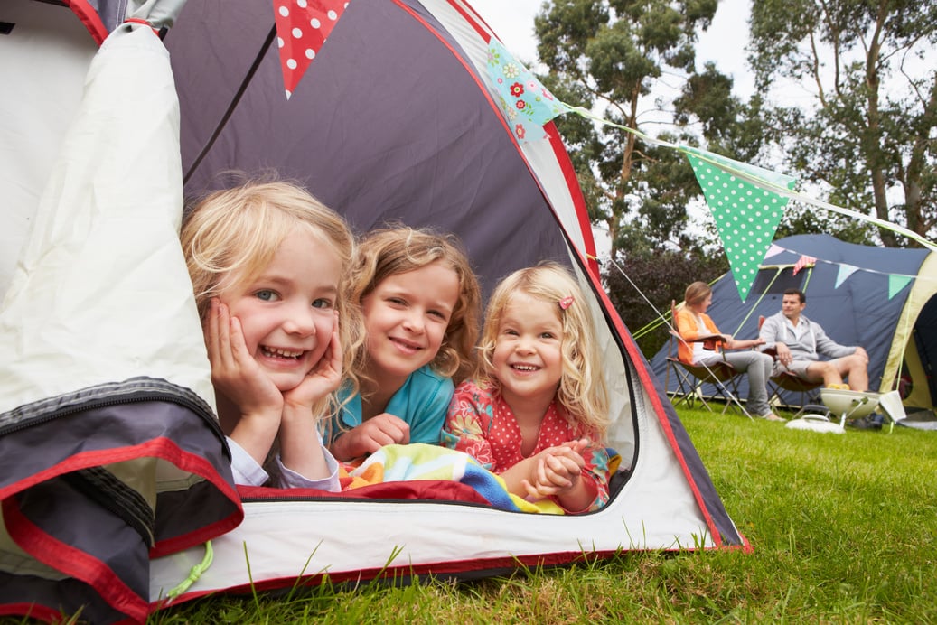 Family Enjoying Camping Holiday On Campsite